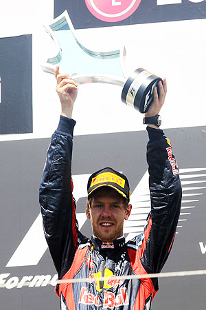 Red Bull's Sebastian Vettel celebrates on the podium after winning the European Formula One Grand Prix in Valencia on Sunday