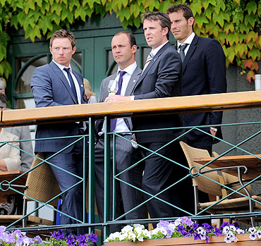 England cricketers Ian Bell (left), Jonathan Trott (centre), Graeme Swann (right) and Chris Tremlett (back) at Wimbledon