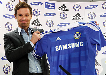 Andre Villas-Boas holds a shirt as he is unveiled as the new Chelsea manager