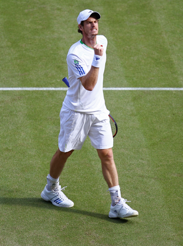 Andy Murray of Great Britain reacts to a play during his quarterfinal round match against Feliciano Lopez of Spain on Day Nine of the Wimbledon Championship