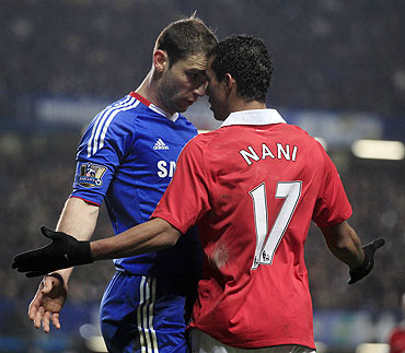 Manchester United's Nani (right) and Chelsea's Branislav Ivanovic get aggressive with each other