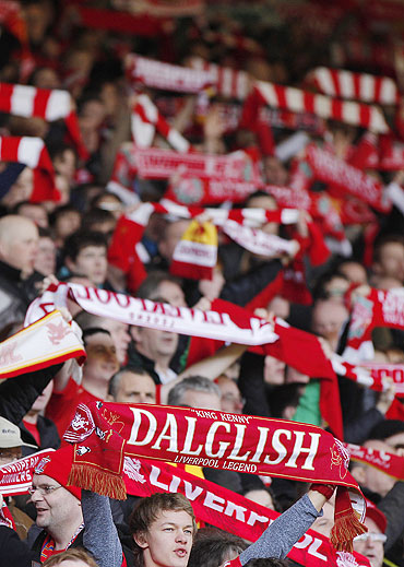 Liverpool supporters hold up scarves and sing Happy Birthday for Daglish