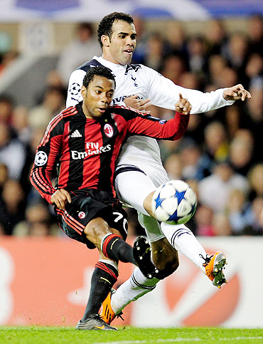 Robinho (left) of AC Milan and Tottenham's Sandro vie for possession