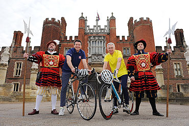 Sebastian Coe and Michael Day pose for the camera at Hampton Court Palace as th new route for the Olympic Games Cycling Time Trial was announced on Thursday