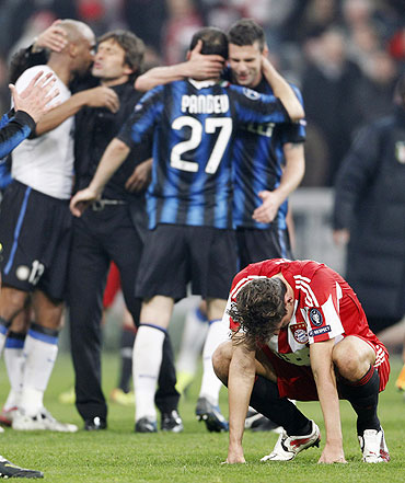 Bayern Munich's Mario Gomez (right) reacts after losing to Inter Milan in Munich on Tuesday