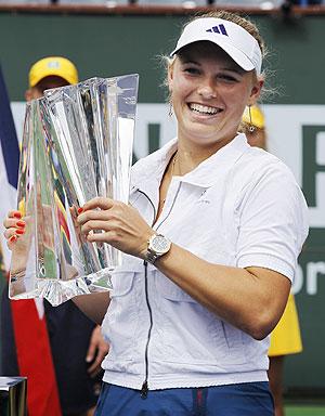 Caroline Wozniacki holds the winners trophy at Indian Wells