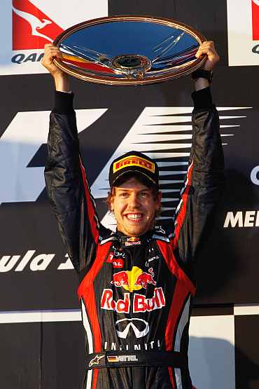 Red Bull's Sebastian Vettel celebrates after winning the Australian GP at the Albert Park Circuit