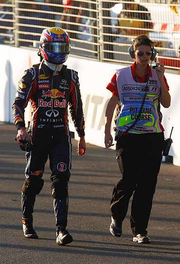 Mark Webber walks back to the paddock area after the Australian Grand Prix