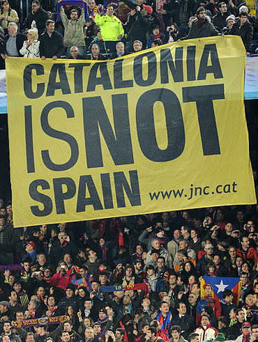 Barcelona supporters hold up a banner