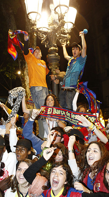 Barcelona's supporters celebrate in the city centre after their team qualified for the Champions League final by beating Real Madrid