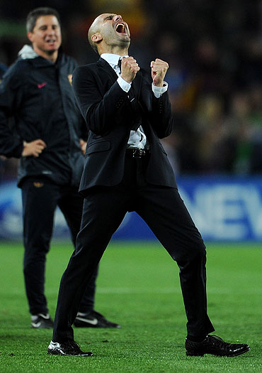 Barcelona's coach Pep Guardiola celebrates after qualifying for the Champions League final