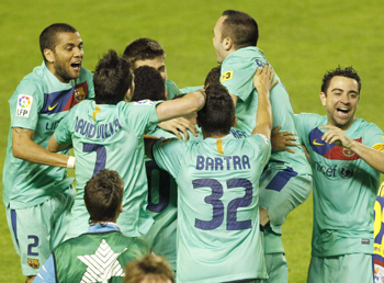 Barcelona's players celebrate after winning the Spanish first division league at the Ciudad de Valencia Stadium in Valencia