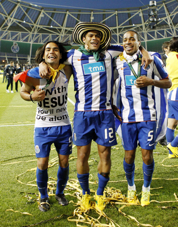 Porto players, from L-R, Falcao, Hulk and Alvaro Pereira celebrate their Europa League final soccer match victory against Braga