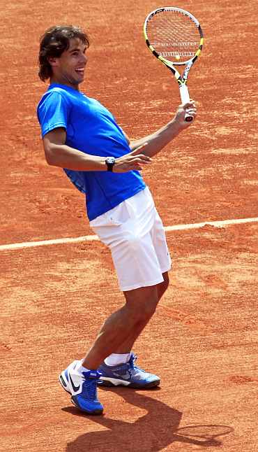 Rafa Nadal laughs during a practice session in Paris