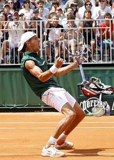 Ruben Ramirez Hidalgo reacts after winning his French Open match against Marin Cilic