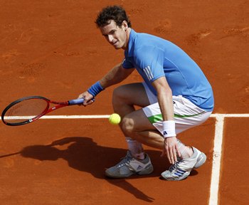 Andy Murray returns the ball to Eric Prodon of France