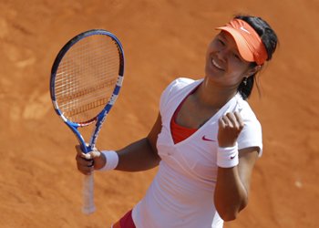Li Na of China celebrates after winning her match against Barbora Zahlavova Strycova