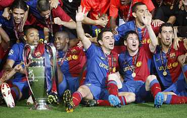 Barcelona players celebrate after winning their Champions League against Manchester United in 2009