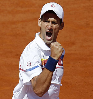 Novak Djokovic of Serbia reacts during his match against Juan Martin Del Potro of Argentina