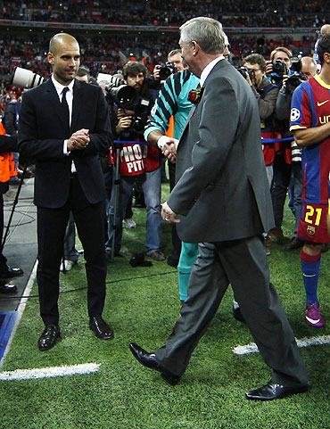 Manchester United's manager Alex Ferguson (centre) congratulates Barcelona's goalkeeper Victor Valdes and manager Pep Guardiola (left) after their Champions League final
