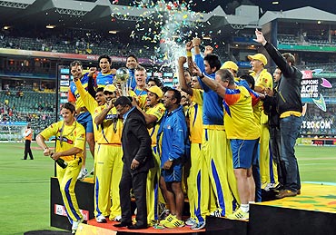 The Chennai Super Kings celebrate with the trophy after winning the 2010 Champions League Twenty20 final