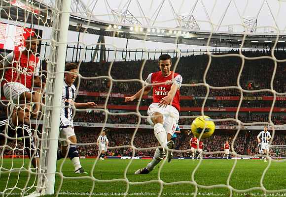 Robin van Persie scores for Arsenal during his match against Blackburn Rovers