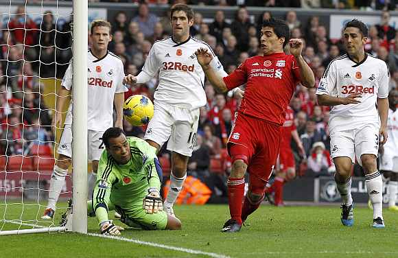 Liverpool's Luis Suarez tries to score against Swansea