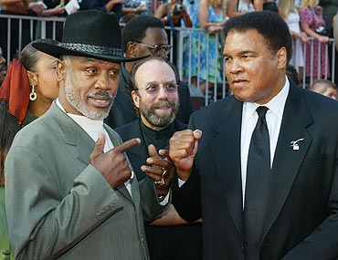 Joe Frazier (left) and Muhammad Ali