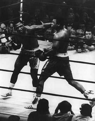 Joe Frazier and Muhammad Ali in action