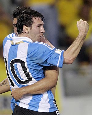 Argentina's Sergio Aguero celebrates with teammate Lionel Messi (10) after he scored the team's second goal against Colombia