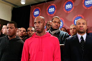 Chauncey Billups, Carmelo Anthony, and Derek Fisher (right) president of the National Basketball Players Association, listen as Billy Hunter, Executive Director of the National Basketball Players Association at a press conference