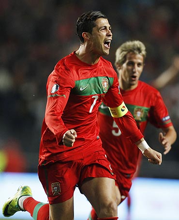 Cristiano Ronaldo of Portugal celebrates after scoring against Bosnia during their Euro 2012 play-off second leg qualifier on Tuesday