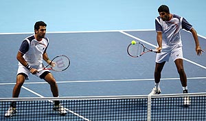 Rohan Bopanna and Aisam-Ul-Haq Qureshi in action against against Max Mirnyi and Daniel Nestor during the men's doubles first round match of the World Tour Finals on Sunday