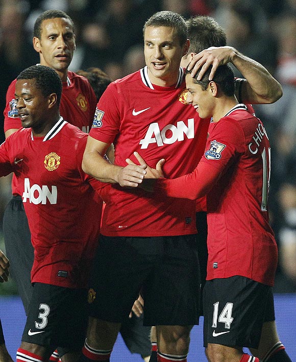 Manchester United's Javier Hernandez (right) celebrates with teammates after scoring against Swansea City
