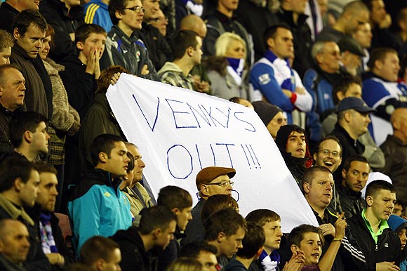 Blackburn fans protest against club owners Venky's and manager Steve Kean during their match between Wigan Athletic on Saturday