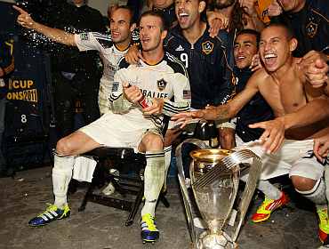 David Beckham celebrates with teammates after winning the Championship