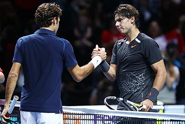 afael Nadal greets Roger Federer
