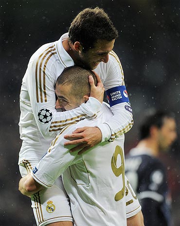 Karim Benzema (right) of Real Madrid celebrates scoring with his team-mate Gonzalo Higuain