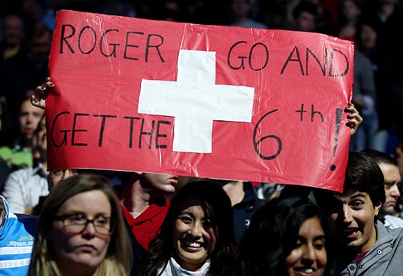 Roger Federer's fans hold up a placard during the World Tour finals on Sunday