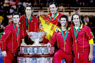 Members of the Spanish team, Marcel Granollers, David Ferrer, head coach Emilio Sanchez, Fernando Verdasco and Feliciano Lopez, pose for photographers after defeating Argentina 3-1 in the Davis Cup final in 2008