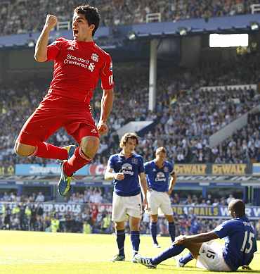 Liverpool's Luiz Suarez celebrates after scoring against Everton