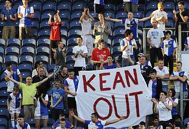 Fans of Blackburn Rovers protest after their match against Manchester City