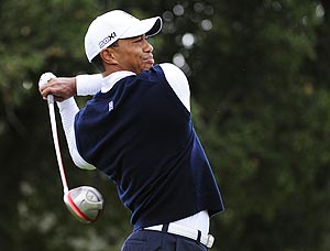 Tiger Woods makes a tee shot on the second hole during the first round of the Frys.com Open on Thursday