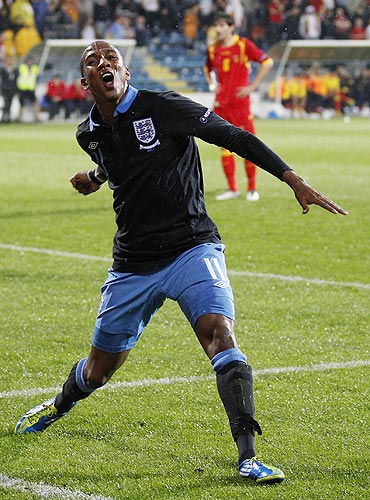 England's Ashley Young celebrates scoring against Montenegro during their Euro 2012 Group G qualifying match
