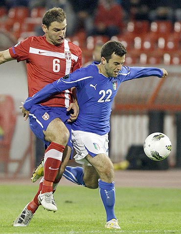 Giuseppe Rossi (22) of Italy challenges Branislav Ivanovic of Serbia during their Euro 2012 Group C qualifying football match