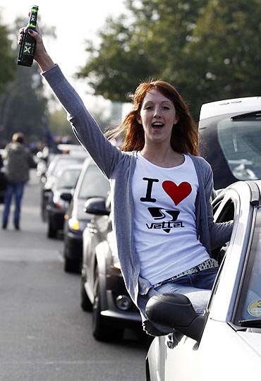 A motor racing fan celebrates in Heppenheim, Germany, after a public viewing of the Suzuka Grand Prix on Sunday