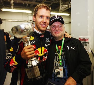 Sebastian Vettel celebrates with his father Norbert Vettel after winning the world championships on Sunday