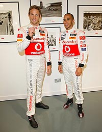 Lewis Hamilton with Jenson Button (left)