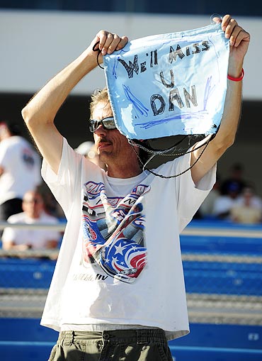 A fan waves a sign after Dan Wheldon died of injuries after a fifteen car crash during the Las Vegas Indy 300 part of the IZOD IndyCar World Championships