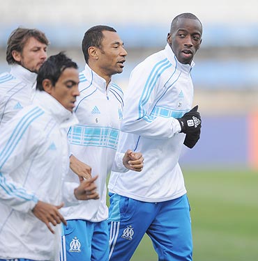 Marseille players warm up during the training session